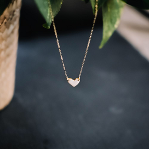 tiny gold-rimmed heart necklace, sweetheart necklace, gold filigree jewelry, white and gold, Austin jewelry, porcelain wearable art, social impact jewelry, ethical accessory