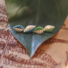 green and gold leaf studs