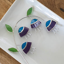 purple and teal stained glass flower branch