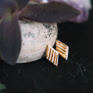 textured golden rhombus porcelain earrings, gold filigree jewelry, white and gold, Austin jewelry, porcelain wearable art, social impact jewelry, ethical accessory