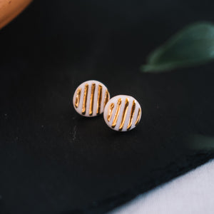 textured golden round porcelain studs, gold filigree jewelry, white and gold, Austin jewelry, porcelain wearable art, social impact jewelry, ethical accessory