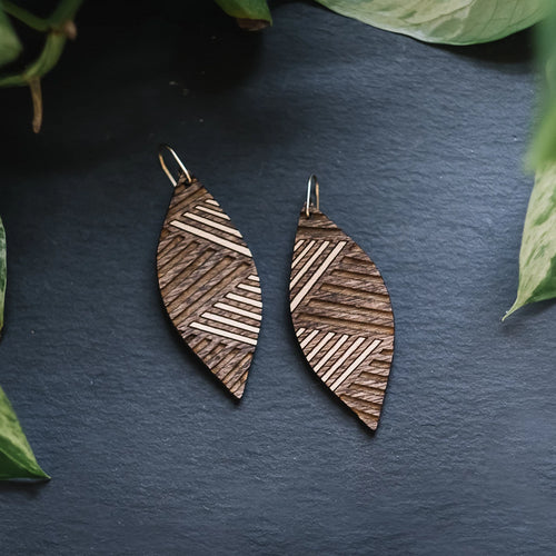 wood leaf earrings with etched lines, gilded wood earrings, Austin jewelry, artisan wood wearable art, social impact jewelry, ethical accessory