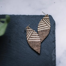 wood leaf earrings with golden etched lines, gilded wood earrings, Austin jewelry, artisan wood wearable art, social impact jewelry, ethical accessory
