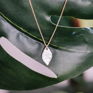 water-etched leaf necklace, white and gold leaf, Austin jewelry, social impact jewelry, ethical accessory