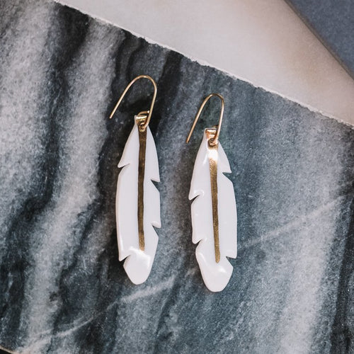 medium feather hanging earrings with gold accent, gold filigree jewelry, white and gold, Austin jewelry, porcelain wearable art, social impact jewelry, ethical accessory