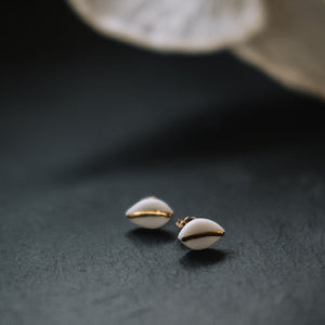 tiny leaf studs with gold accent, gold filigree jewelry, white and gold, Austin jewelry, porcelain wearable art, social impact jewelry, ethical accessory