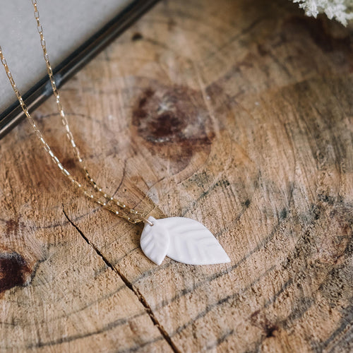 medium stacked water etched porcelain leaves necklace, Austin jewelry, porcelain wearable art, social impact jewelry, ethical accessory