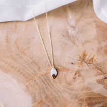 tiny white porcelain leaf gold glazed necklace, gold filigree jewelry, white and gold, Austin jewelry, porcelain wearable art, social impact jewelry, ethical accessory