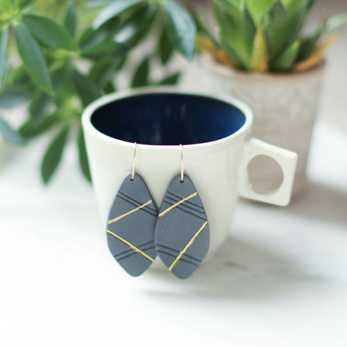 grey and gold earrings, porcelain jewelry, grey and gold jewelry, austin jeweler, austin brand, ethical jewelry, porcelain earrings, clay earrings