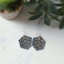 grey hexagon earrings, porcelain jewelry, porcelain earrings, clay jewelry, grey jewelry, gray jewelry, remnant studios, non-profit jewelry, ethical jewelry, gold and grey, gold and grey jewelry