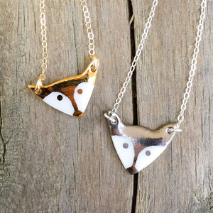 porcelain fox necklace with gold accent, gold filigree jewelry, white and gold, Austin jewelry, porcelain wearable art, social impact jewelry, ethical accessory