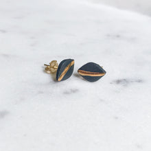 tiny leaf studs with gold accent, gold filigree jewelry, white and gold, charcoal and gold, Austin jewelry, porcelain wearable art, social impact jewelry, ethical accessory