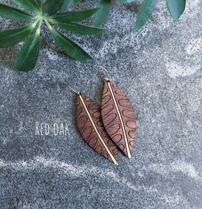 wood leaf earrings with lined arches, gilded wood earrings, Austin jewelry, artisan wood wearable art, social impact jewelry, ethical accessory