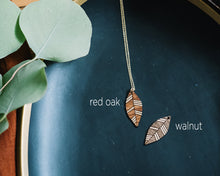wood leaf necklace with gold accent, gilded wooden necklace, Austin jewelry, artisan wood wearable art, social impact jewelry, ethical accessory