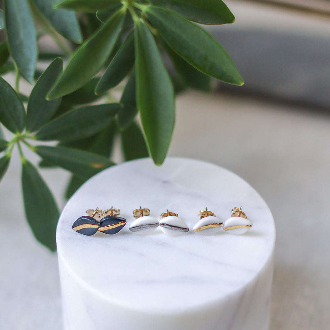 tiny leaf studs with gold accent