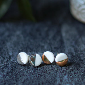 white and gold accented studs