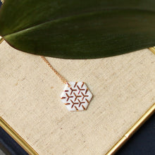 white and gold hexagon necklace